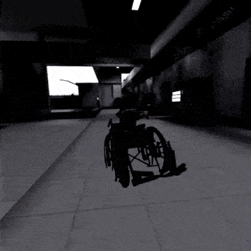 a wheelchair is in a dark room with a window