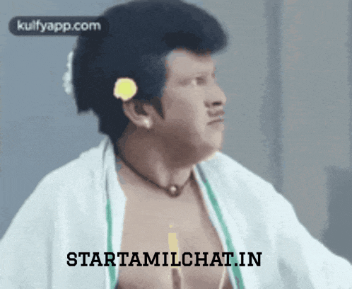 a man with a flower in his hair is shown with the words starttamilchat.in below him