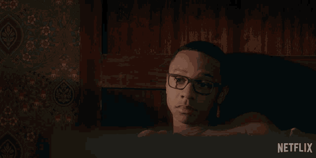 a man with glasses is laying in a bathtub with the words right written above him