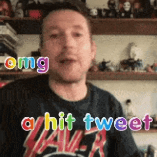 a man wearing a slayer shirt is making a funny face and saying a hit tweet .