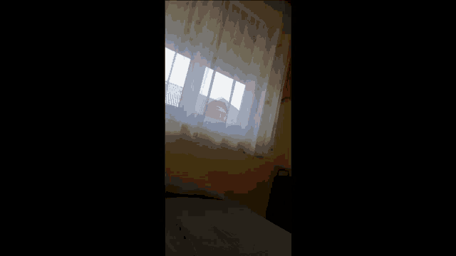 a blurry picture of a person 's face with a red and yellow glow .