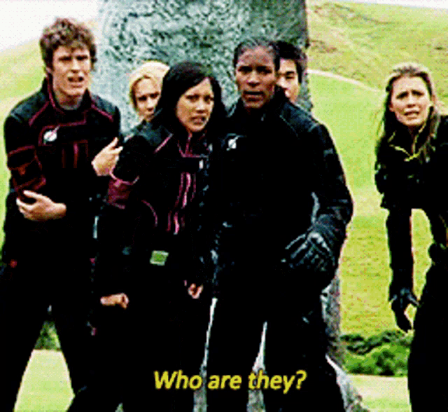a group of people standing next to each other with the words who are they on the bottom right