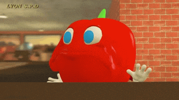 a red apple with blue eyes and a green stem says lyon s.p.d.