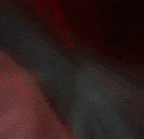 a blurry image of a red and black background