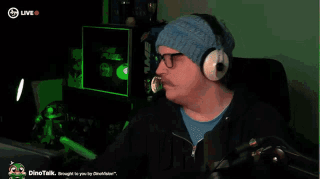 a man wearing headphones says no horny in front of a computer