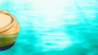 a person in a yellow shirt is swimming in a blue pool