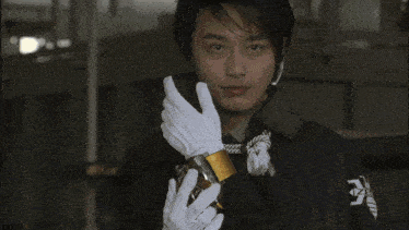 a man in a suit is surrounded by pipes and a glowing circle