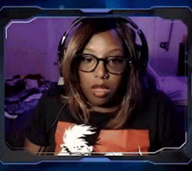 a woman wearing glasses and headphones is in a video frame