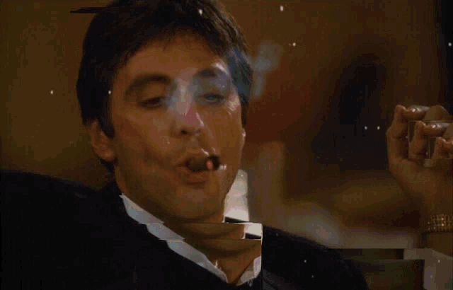 a man in a tuxedo smoking a cigar with smoke coming out of his mouth