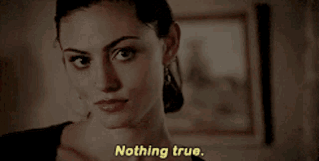 a close up of a woman 's face with the words " nothing true " on the bottom
