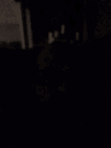 a blurry picture of a person 's face in the dark
