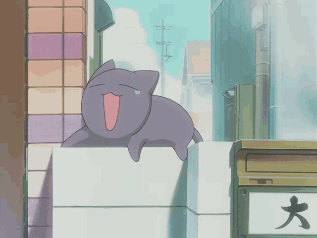a cartoon cat is sitting on a ledge next to a mailbox with chinese characters on it