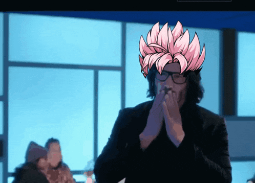 a man wearing glasses and a pink wig is covering his mouth with his hands