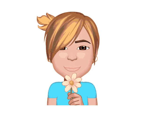 a woman in a blue shirt is holding a flower in her hand