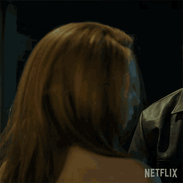 a close up of a woman with a netflix logo in the corner