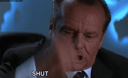 a man in a suit and tie is making a funny face and says shut