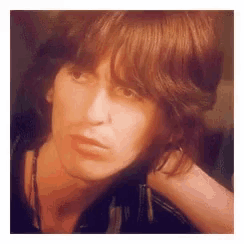 a close up of a woman 's face with long hair