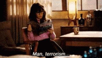 a woman is reading a book and says man terrorism