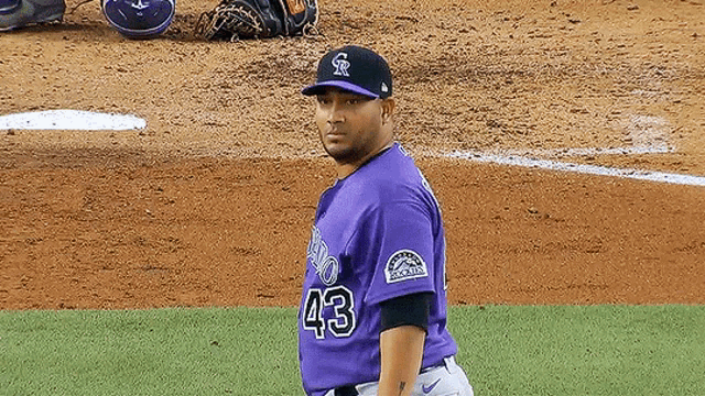 a baseball player wearing a purple jersey with the number 43
