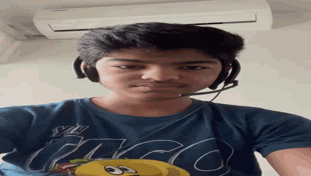 a young man wearing headphones and a shirt that says ' abercrombie ' on it