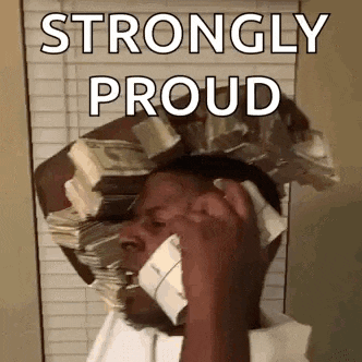 a man is talking on a cell phone while holding a stack of money on his head .