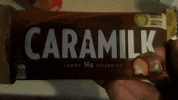 someone is holding a bar of caramelk chocolate