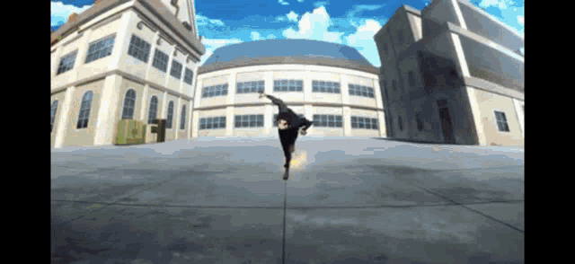 a person is doing a handstand in front of a building