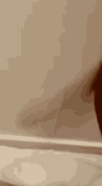 a close up of a person 's face with a blurred background .