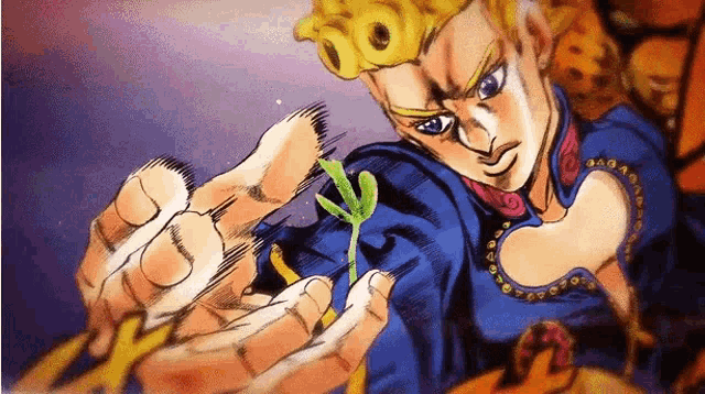 a man is holding a small plant in his hands .