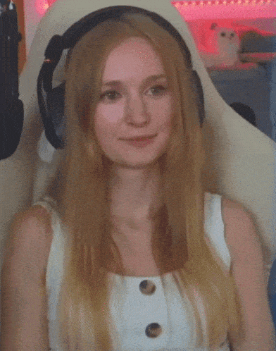 a woman wearing headphones says " fuck yeah !!! "