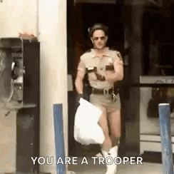 a man in a sheriff 's uniform is carrying a trash bag and says `` you are a trooper '' .