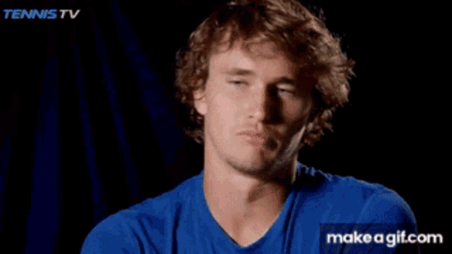 a man in a blue shirt is smiling with the words put myself in there behind him