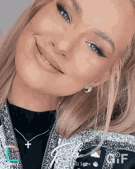 a close up of a woman 's face with the word gif on the bottom left