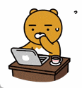 a cartoon bear is sitting at a table with a laptop computer and a cup of coffee .