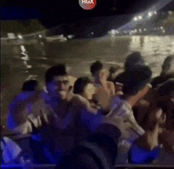 a group of people on a boat with the hgx logo on the bottom right