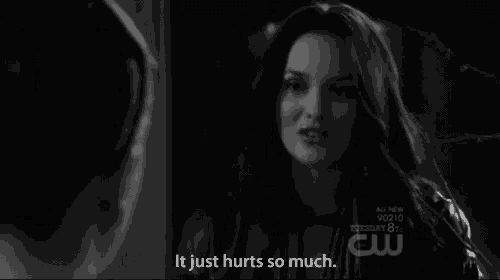 a black and white photo of a woman talking to another woman with the caption it just hurts so much
