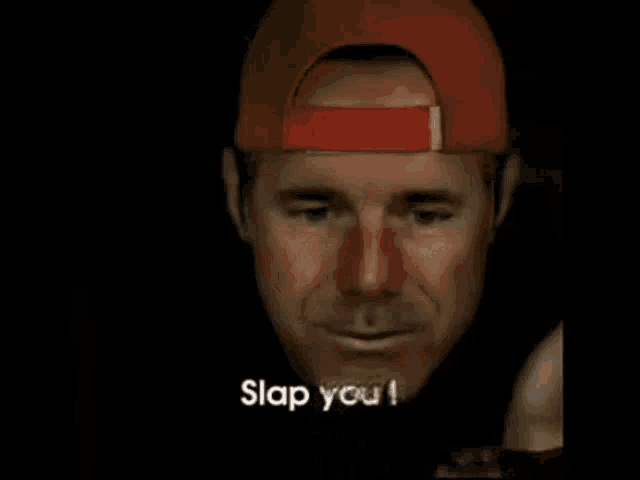 a man wearing a red hat is saying " slap you "