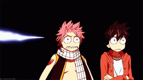 a couple of anime characters standing next to each other with their arms crossed and making funny faces .