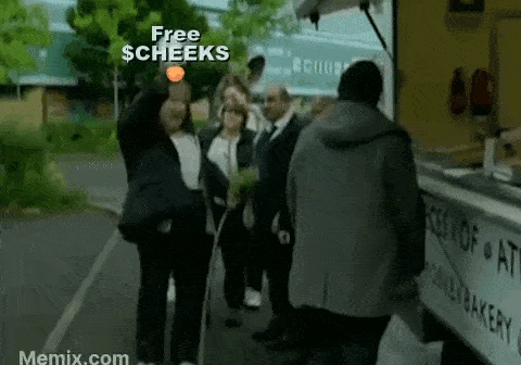 a group of people standing in front of a food truck that says free $ cheeks