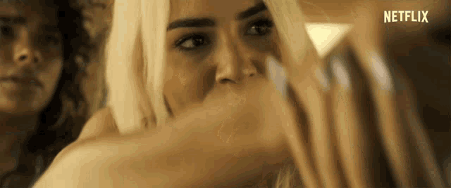 a close up of a woman 's face with netflix written on the bottom