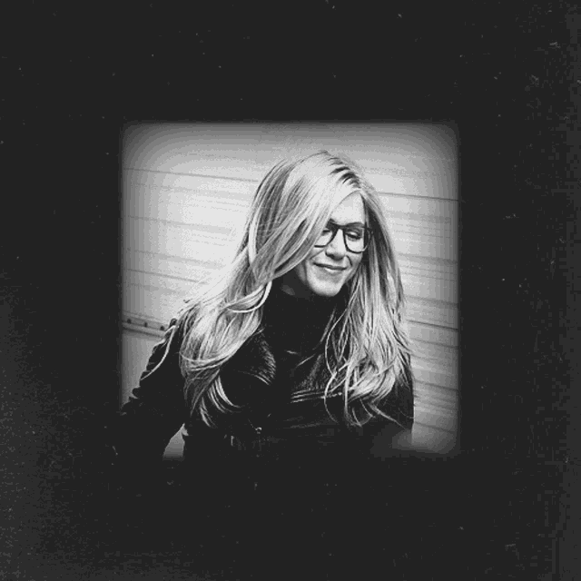 a black and white photo of a woman with a silhouette of a man behind her