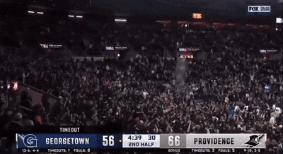 a crowd of people watching a georgetown vs providence game