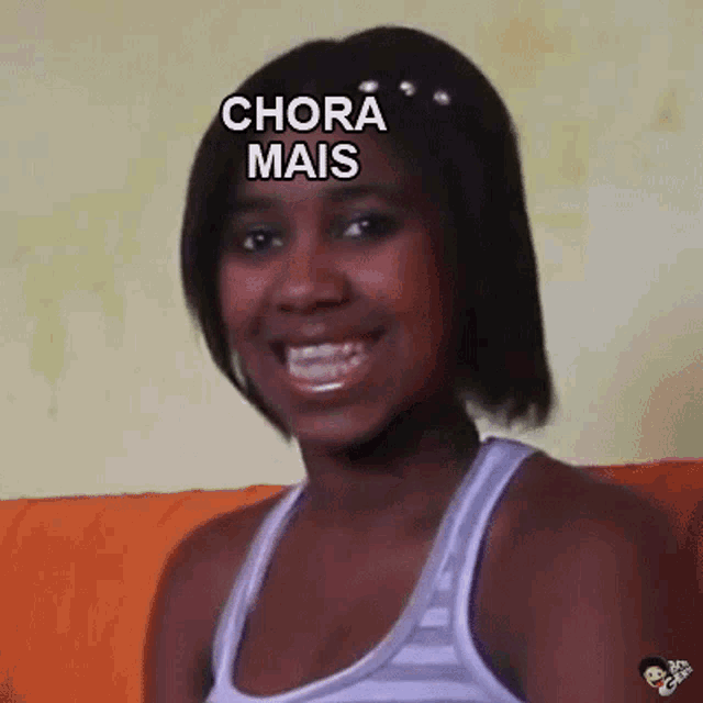 a woman is sitting on a couch with the words chora mais written on her face