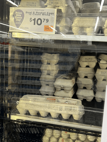 a display of eggs with a price rite sign