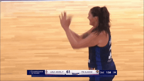 a female basketball player with the number 3 on her back