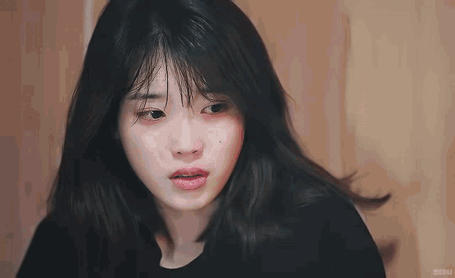a close up of a woman 's face with the word chuu on the bottom right corner