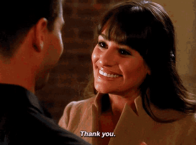 a woman says thank you to a man in a close up