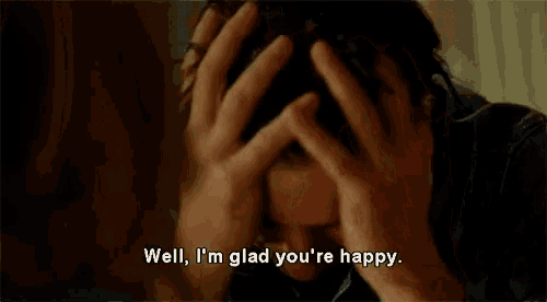a man is covering his face with his hands and saying `` well , i 'm glad you 're happy ''