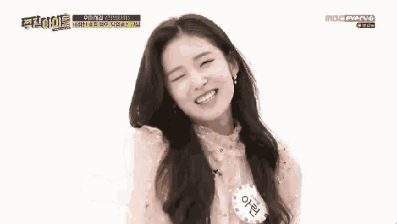 a girl with long hair is smiling in front of a mbc pvp logo