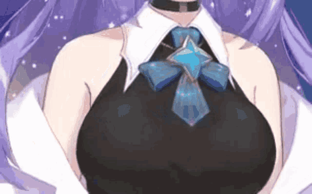 a close up of a woman 's breasts with a blue bow on her neck